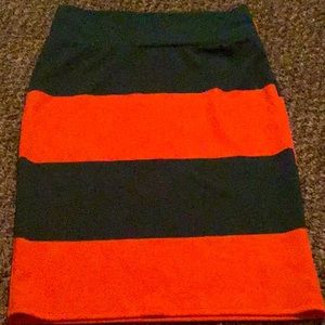 A dark green and orange skirt. Size M